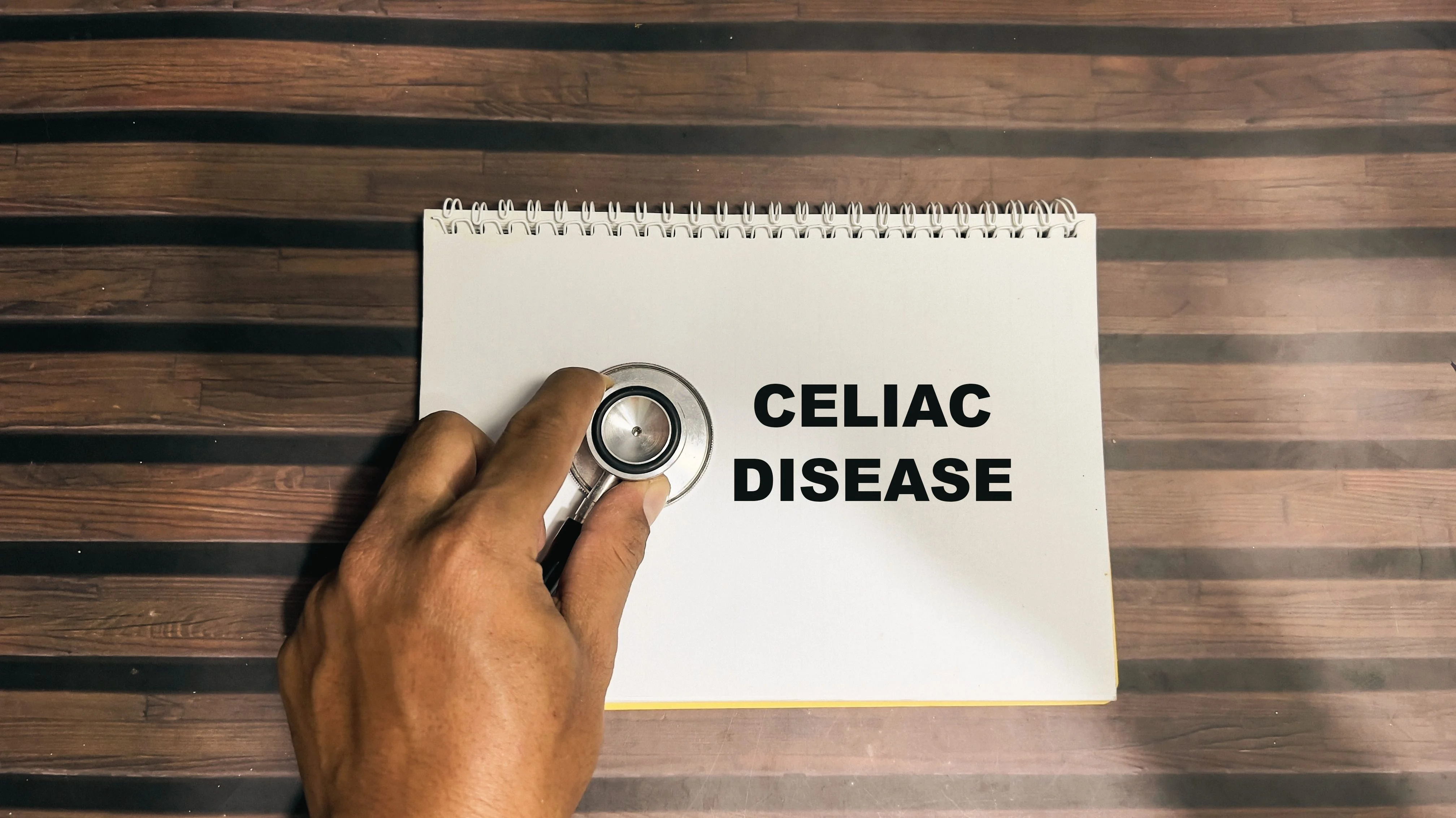 Notebook featuring the words coeliac disease and a stethoscope