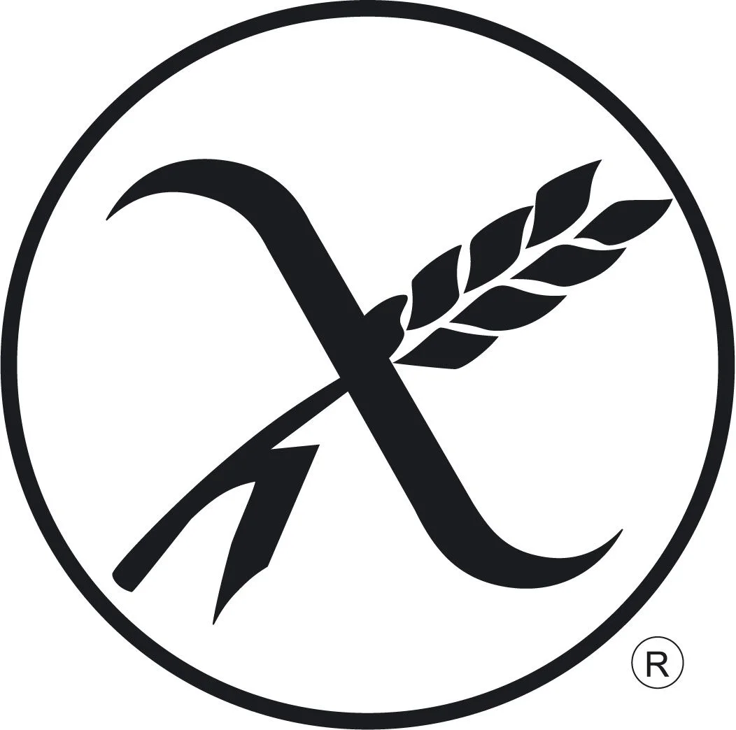 Un símbolo estilizado de 'X' cruzado con un espiga de trigo dentro de un borde circular, indica certificación sin gluten