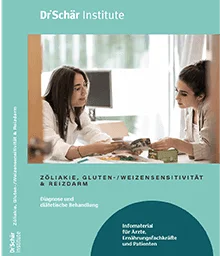 Zwei Frauen diskutieren über Glutenempfindlichkeit in einem hellen, modernen Büro mit Unterlagen und einem Laptop auf dem Tisch