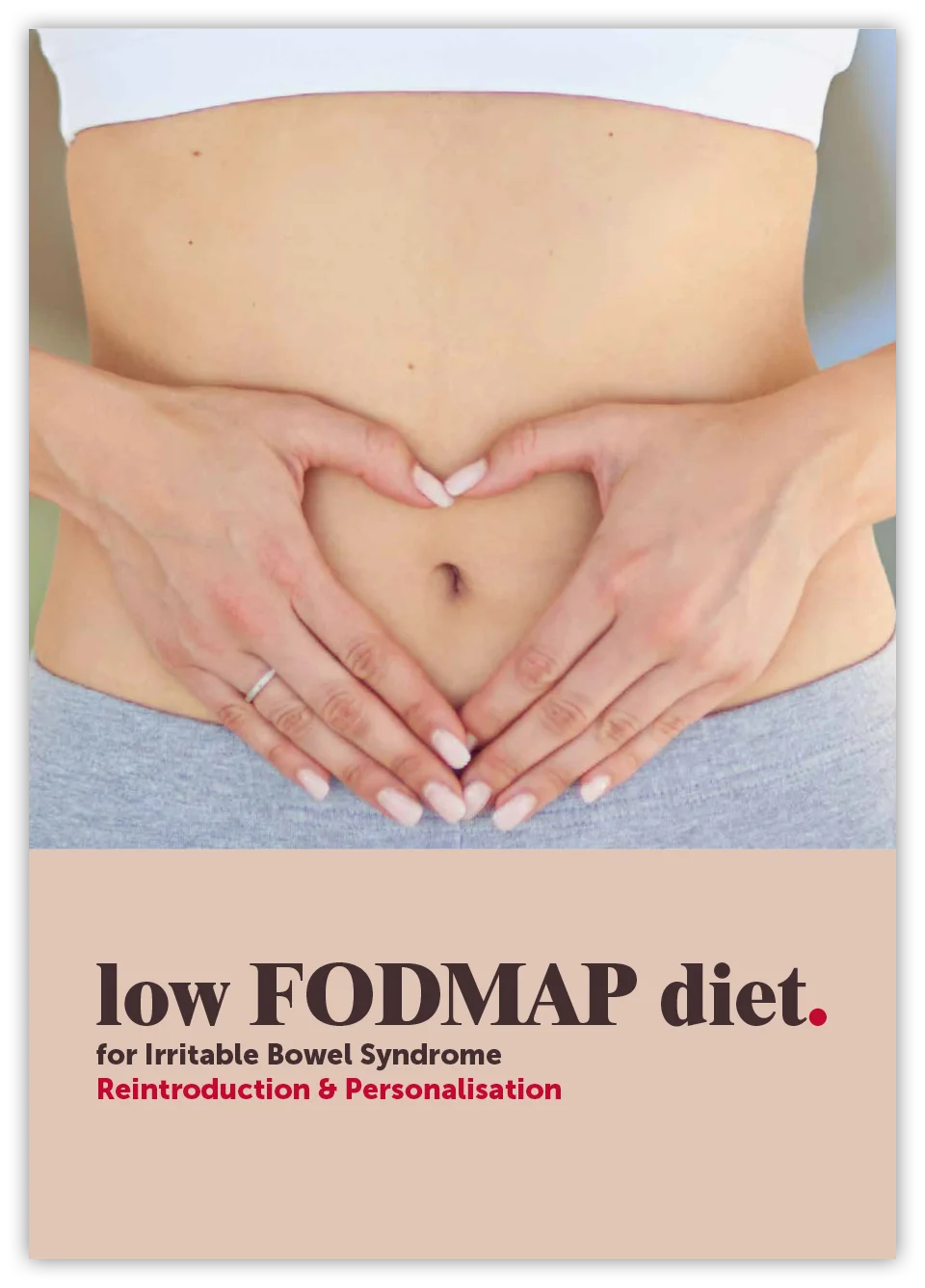 A person with their hands forming a heart shape on their stomach, promoting a low FODMAP diet for IBS