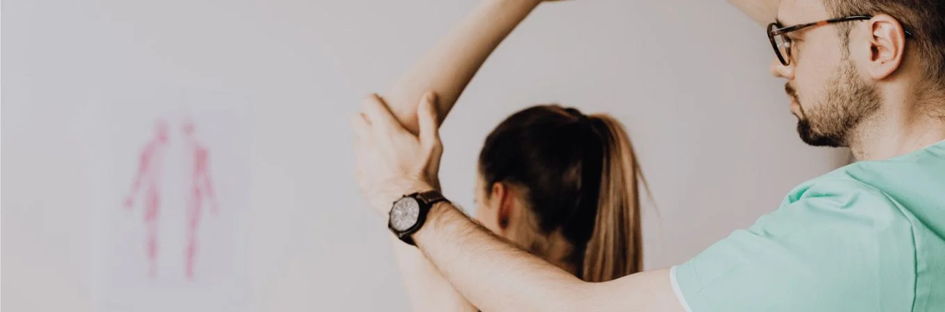 a physiotherapist helping a patient