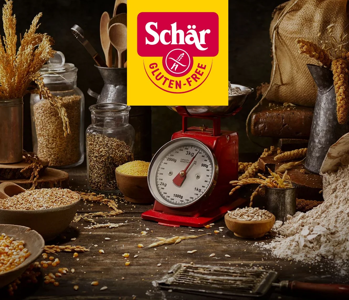 A rustic kitchen scene with grains in jars, a red scale, and flour on a wooden table, showcasing gluten-free ingredients