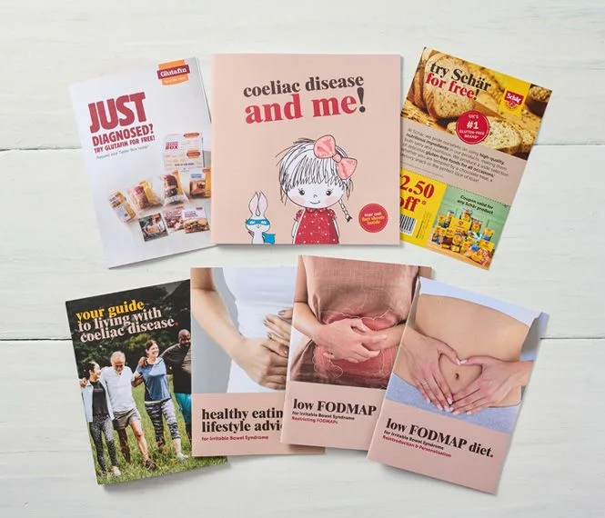 A collection of brochures about coeliac disease, featuring illustrations, dietary advice, and promotional offers